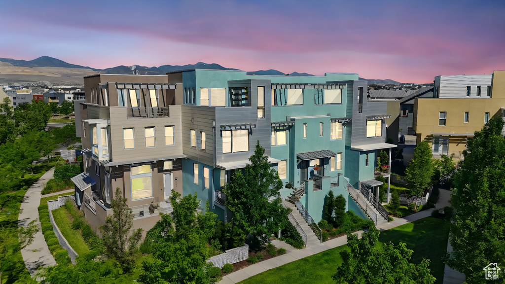 View of front facade featuring stucco siding and a mountain view