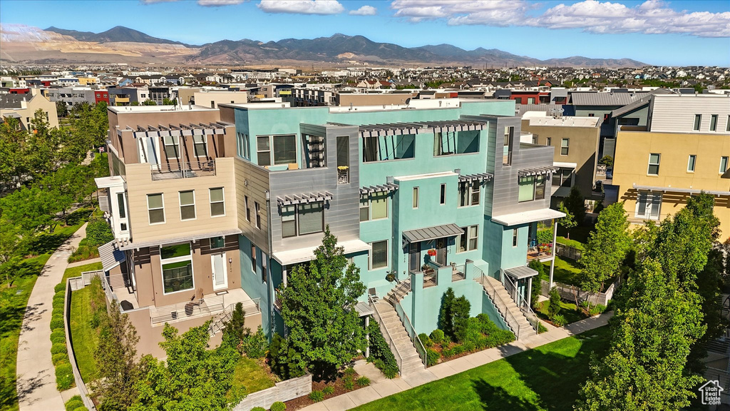 Aerial perspective of suburban area with a mountainous background