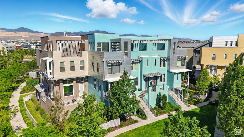 Aerial view of residential area featuring a mountain backdrop