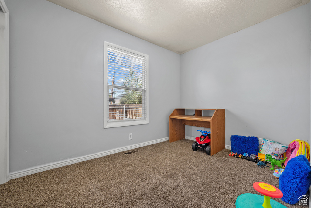 Playroom with carpet and baseboards