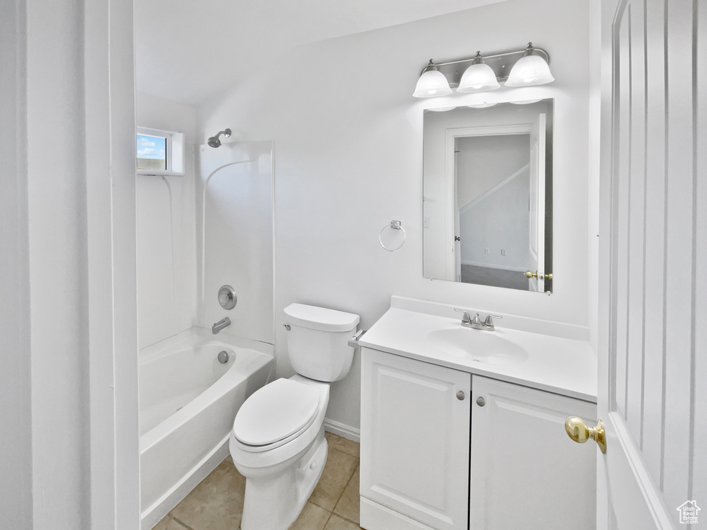 Full bathroom with vanity, shower / washtub combination, and tile patterned flooring