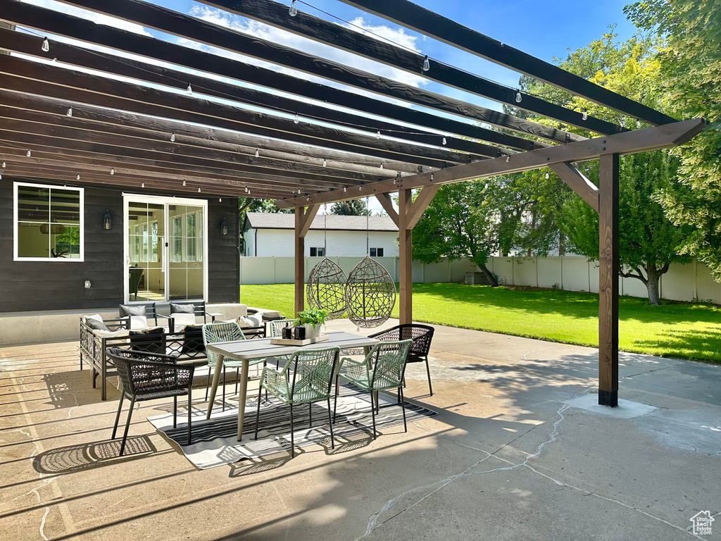 Fenced backyard with a pergola, outdoor lounge area, outdoor dining area, and a deck