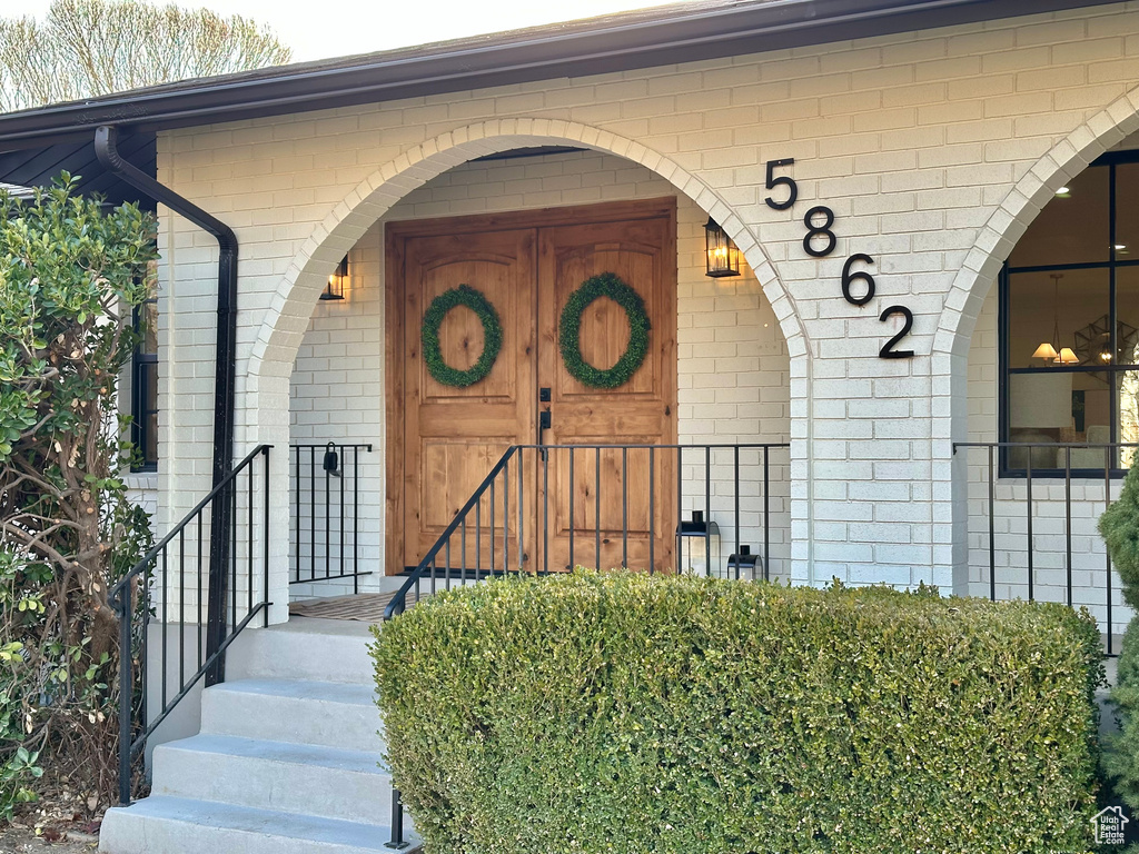 Entrance to property with brick siding