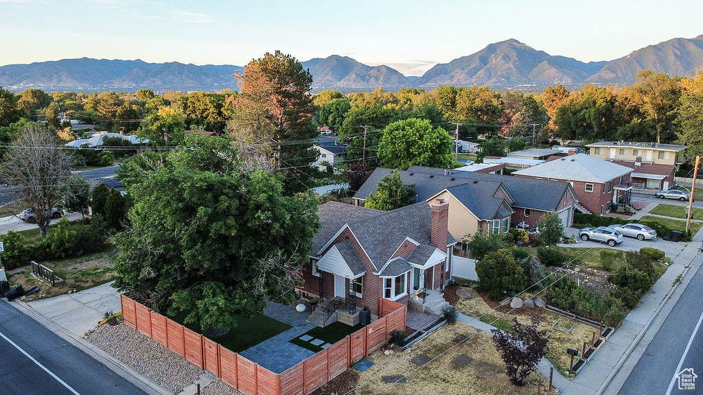 Aerial view of property and surrounding area featuring mountains