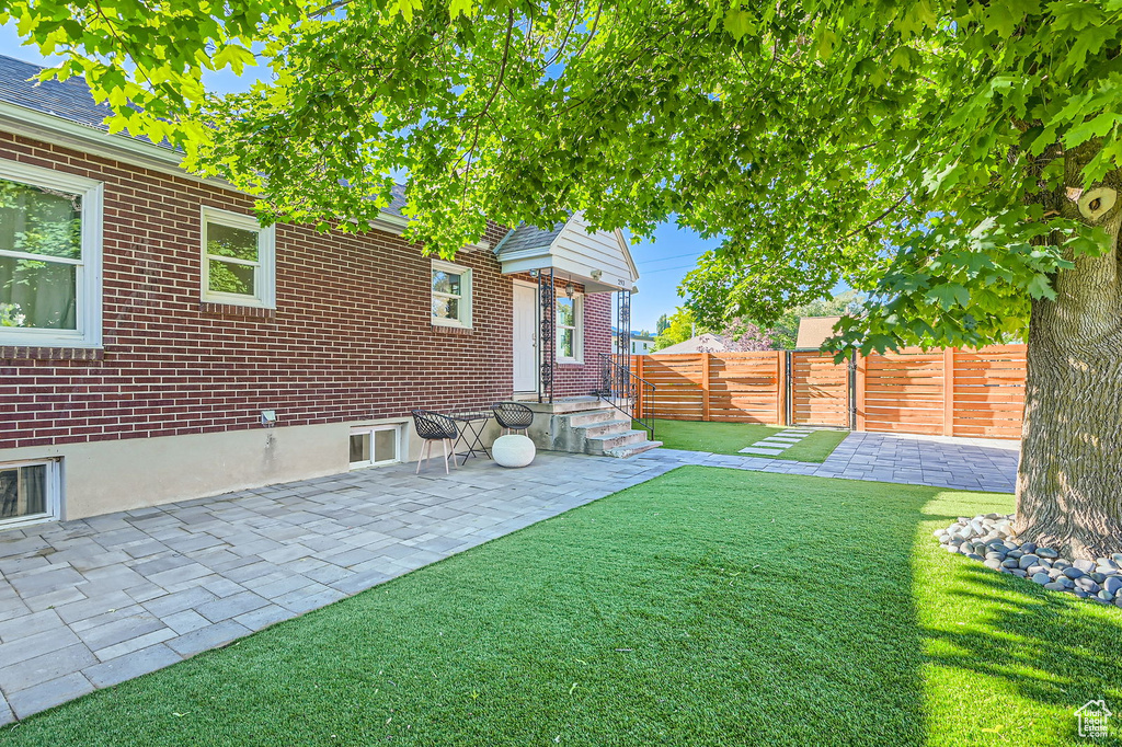 View of yard with a patio