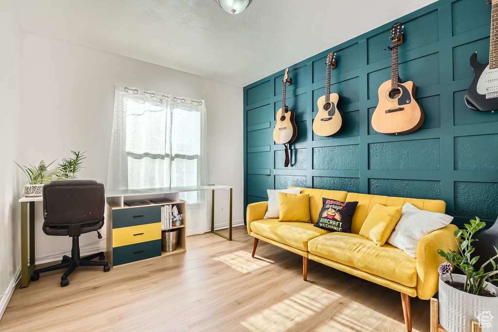 Living area featuring wood finished floors and baseboards