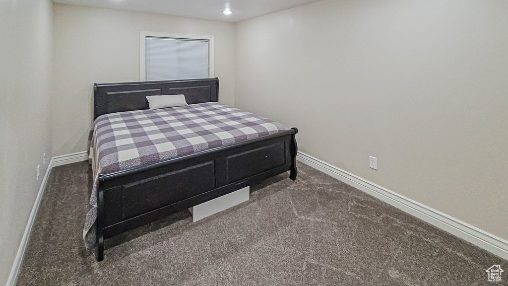 Carpeted bedroom with baseboards and recessed lighting
