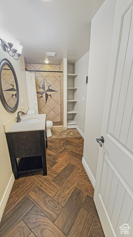 Full bath featuring vanity and tiled shower