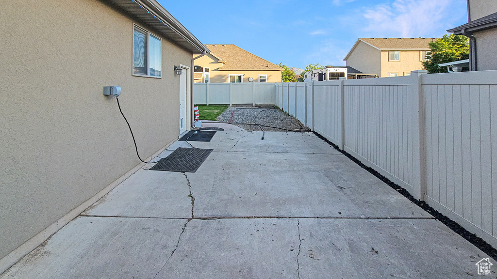 Fenced backyard with a patio