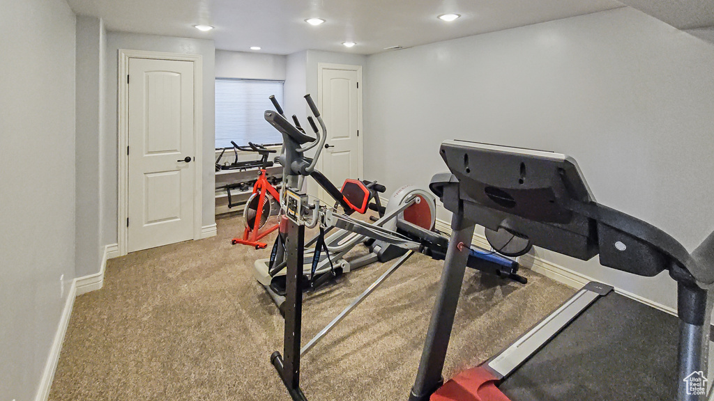 Workout room featuring baseboards and recessed lighting