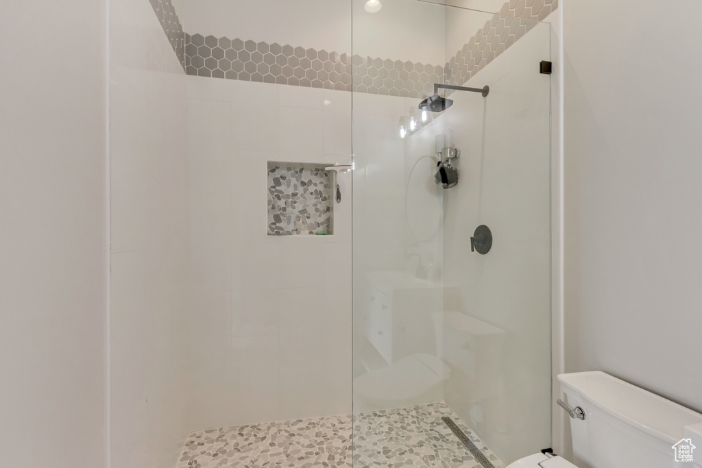 Full bathroom with toilet and a walk in shower