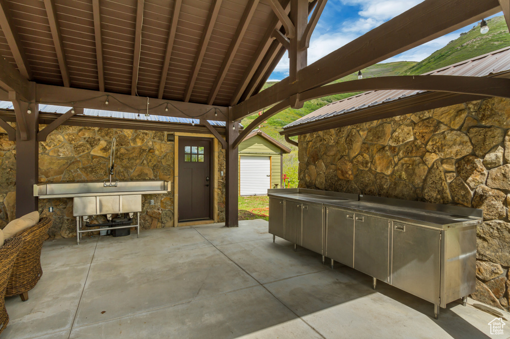 View of patio / terrace featuring an outbuilding