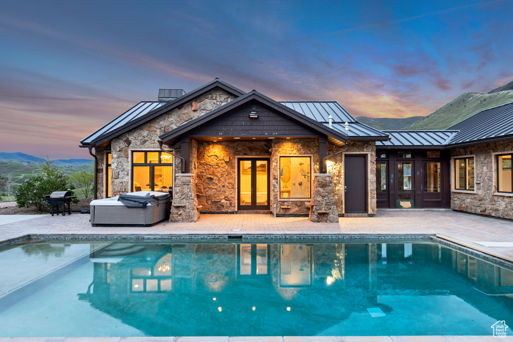 Swimming pool featuring a patio area and grilling area