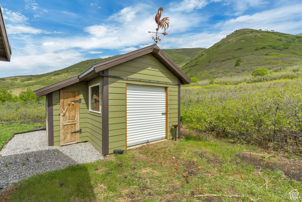 View of outdoor structure with a mountain view and an outbuilding