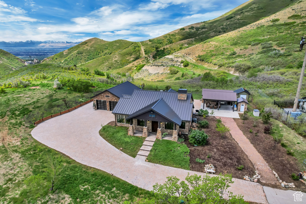 View from above of property with a mountain backdrop