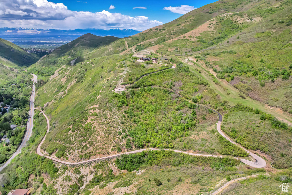 Aerial view of property\'s location featuring a mountainous background
