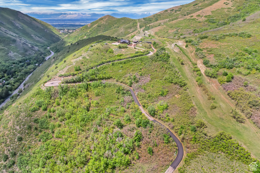 Aerial view of property\'s location featuring a mountain backdrop