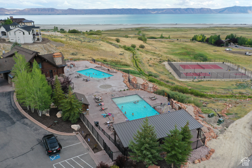 View from above of property featuring a pool and a water and mountain view