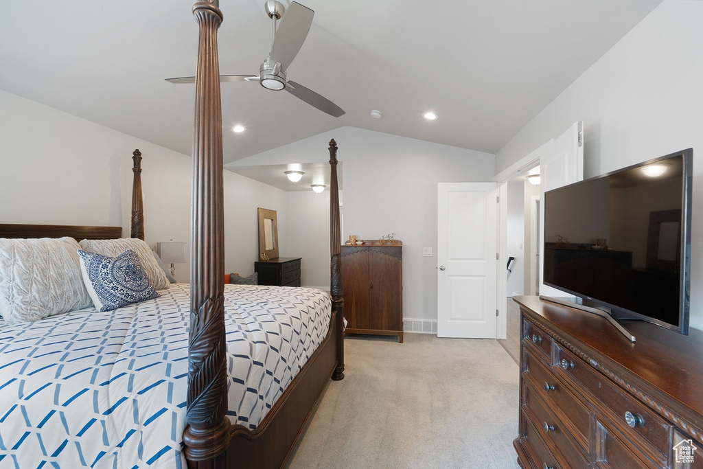 Bedroom featuring light colored carpet, lofted ceiling, a ceiling fan, recessed lighting, and baseboards