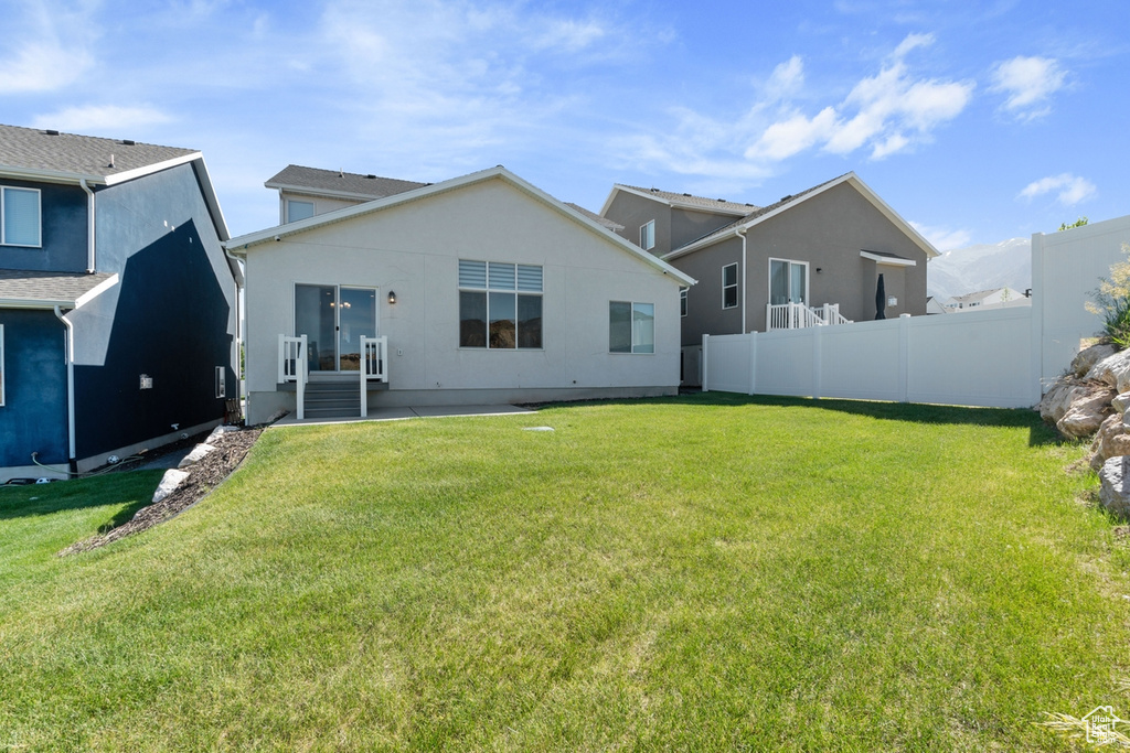 Back of property with stucco siding