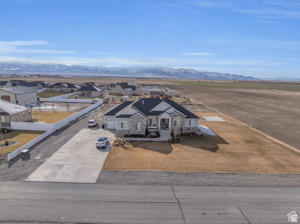 Aerial perspective of suburban area with a mountain backdrop