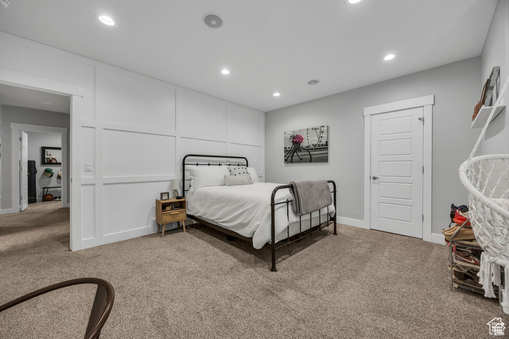 Carpeted bedroom with recessed lighting and baseboards