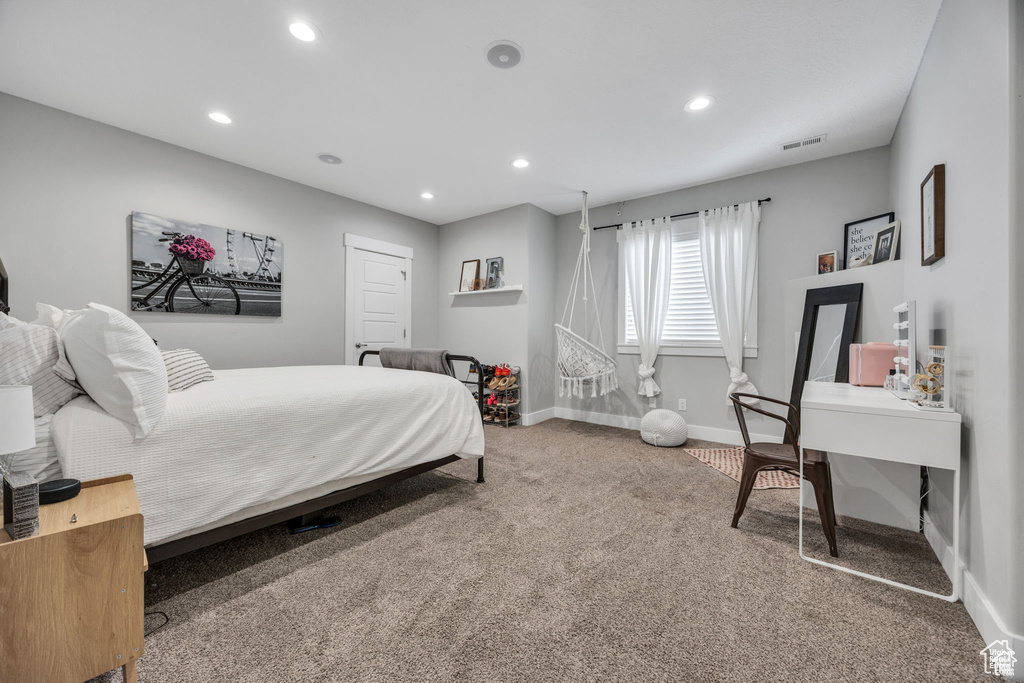 Carpeted bedroom featuring baseboards and recessed lighting