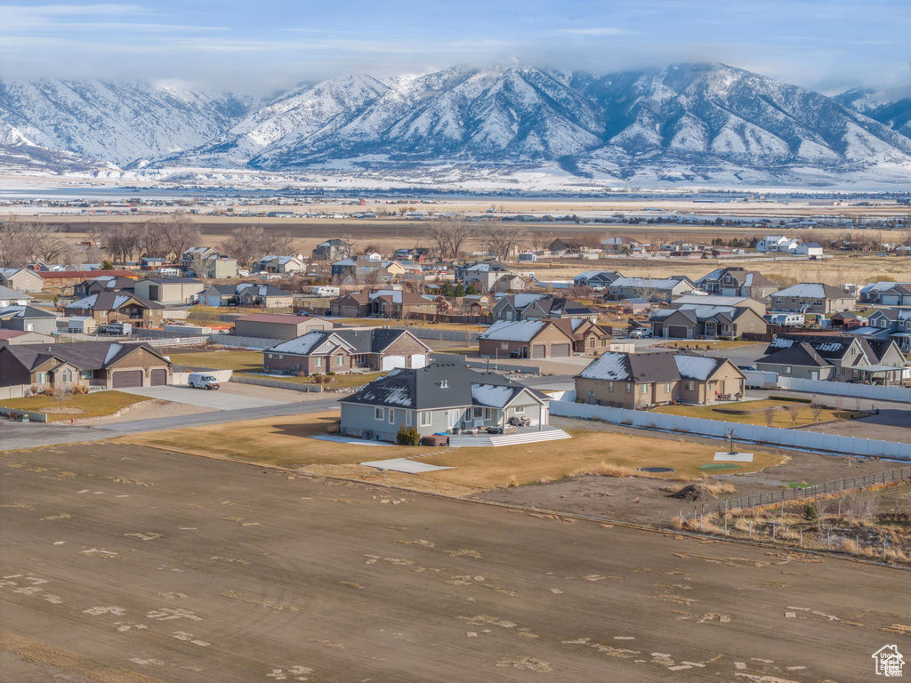 Aerial view of residential area featuring a mountain backdrop