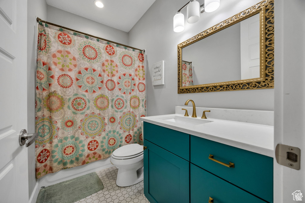 Full bathroom with vanity, recessed lighting, and shower / tub combo with curtain
