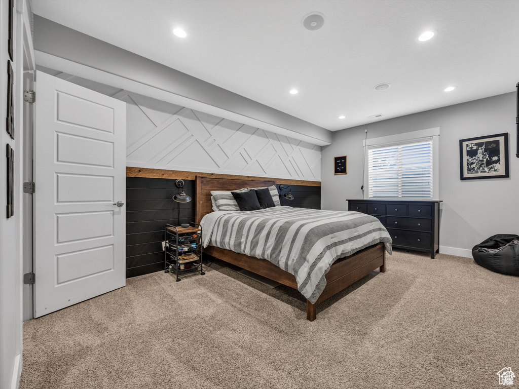 Carpeted bedroom with recessed lighting and baseboards