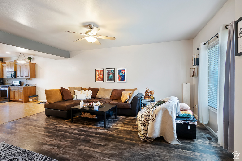 Living area featuring ceiling fan and wood finished floors