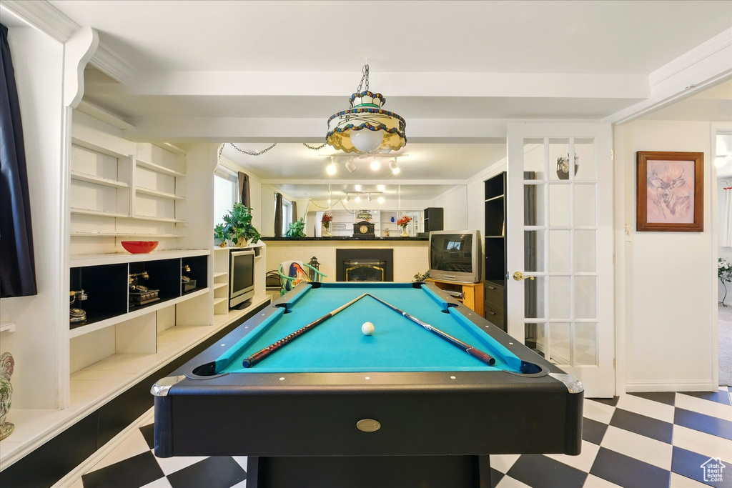 Game room with tile patterned floors and pool table