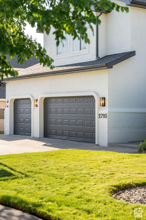 Garage featuring driveway