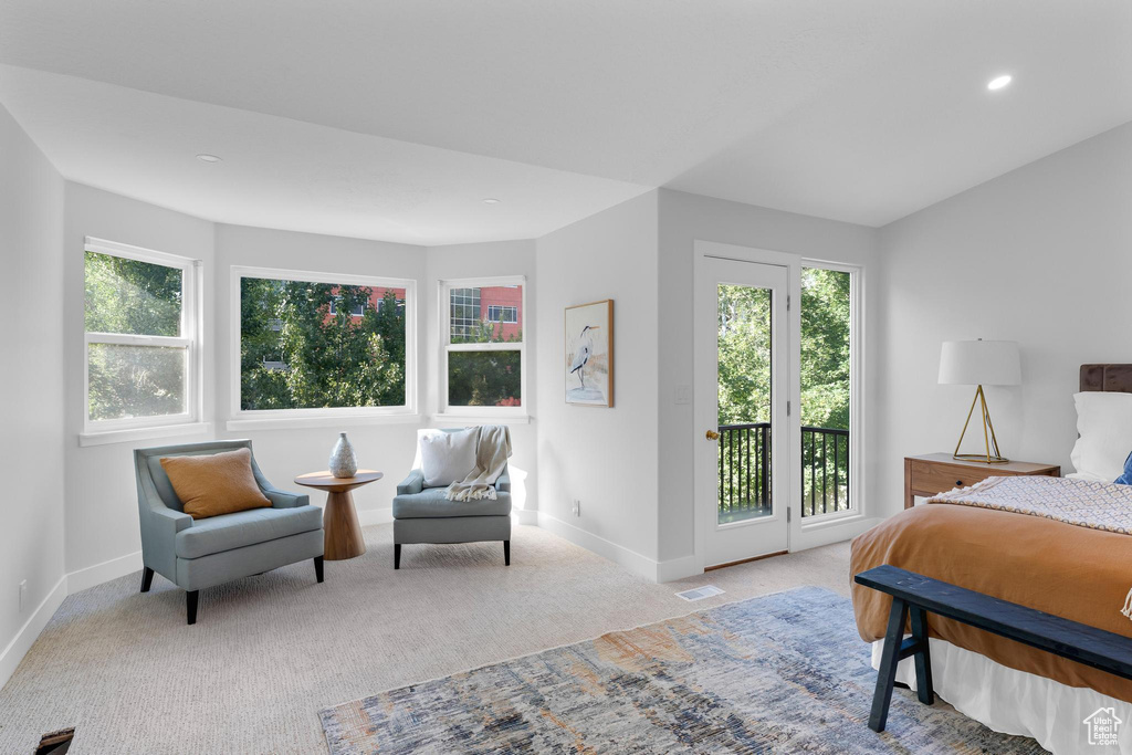 Carpeted bedroom with access to outside, multiple windows, baseboards, and recessed lighting