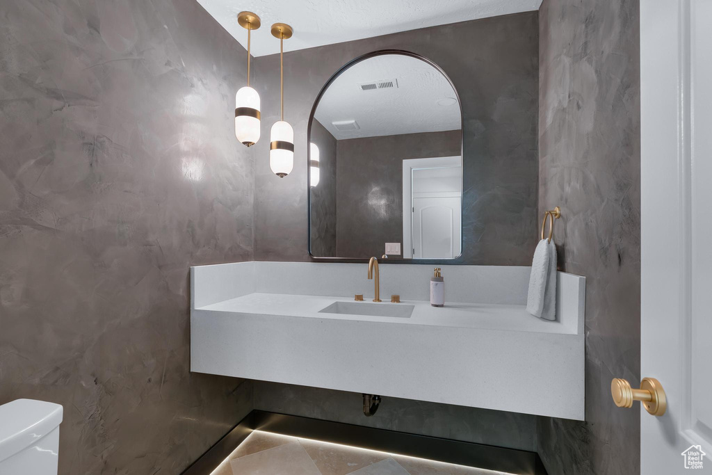 Bathroom featuring toilet and vanity