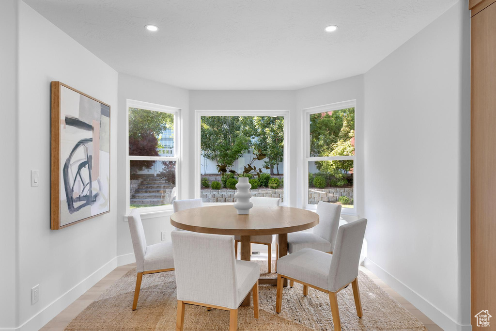 Dining area with healthy amount of natural light, recessed lighting, and baseboards