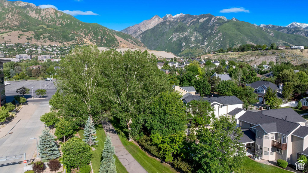 Aerial view of property\'s location with a mountain backdrop and nearby suburban area
