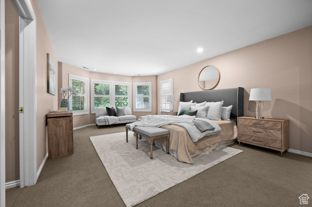 Carpeted bedroom with baseboards and recessed lighting