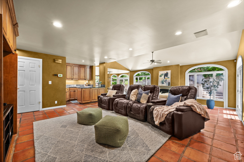 Living area with recessed lighting, a ceiling fan, baseboards, and tile patterned floors