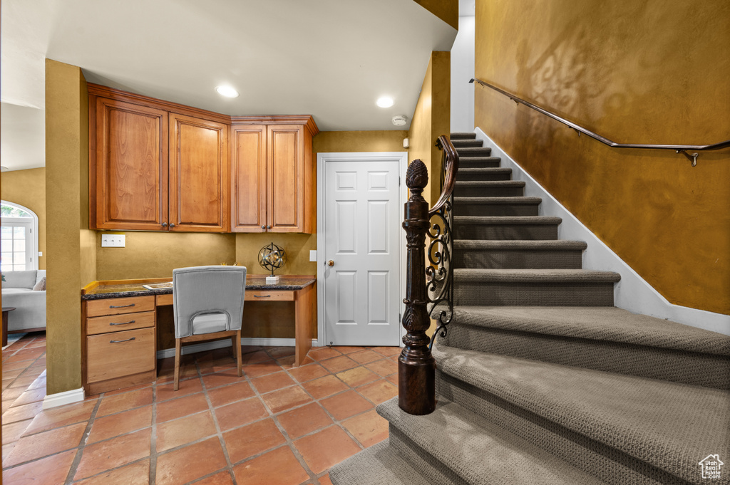 Office featuring built in study area and recessed lighting