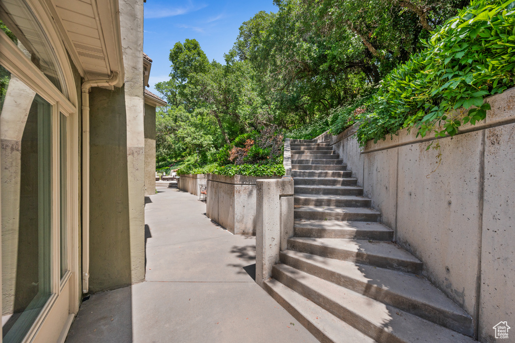 View of patio featuring stairway