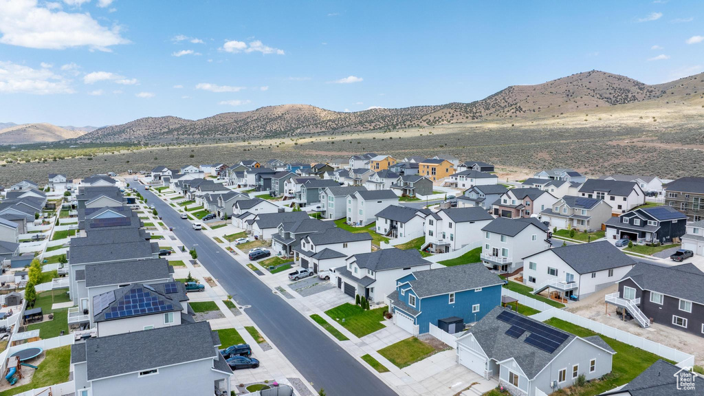 Aerial perspective of suburban area with a mountain backdrop