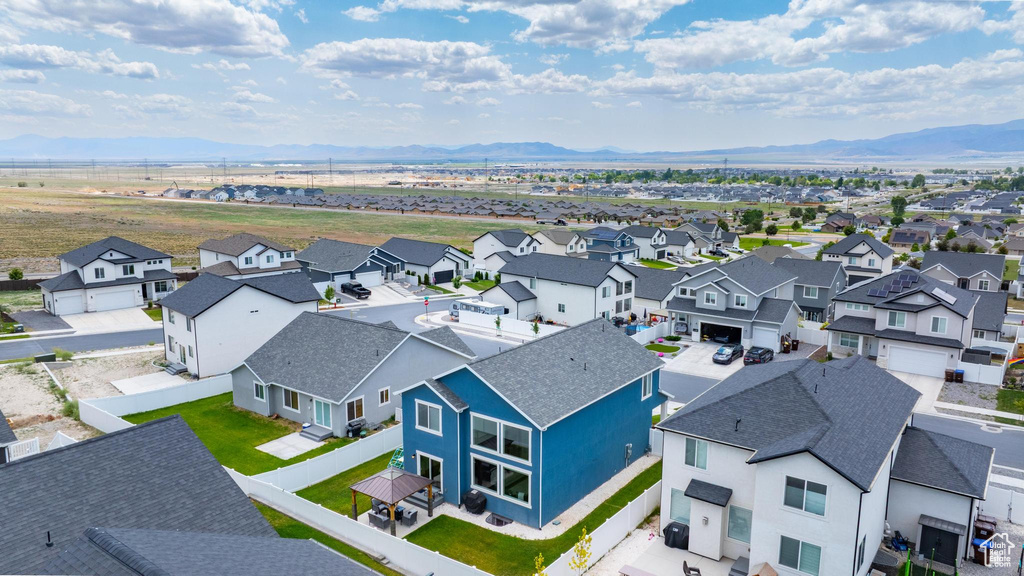 Aerial perspective of suburban area with a mountainous background