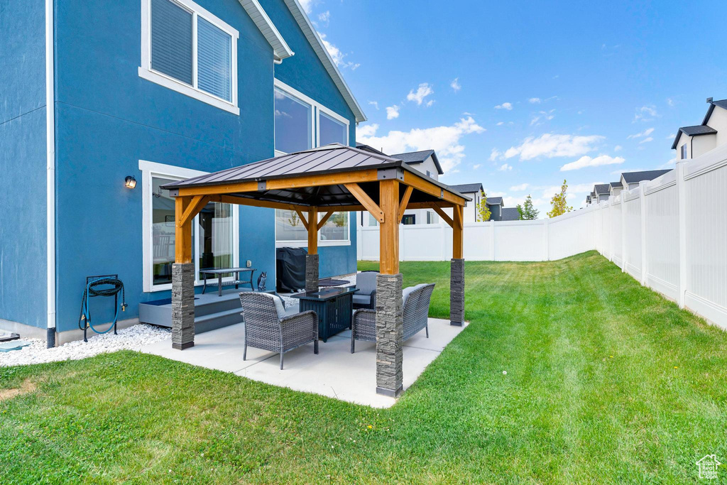 View of yard with a gazebo, outdoor lounge area, and a patio area