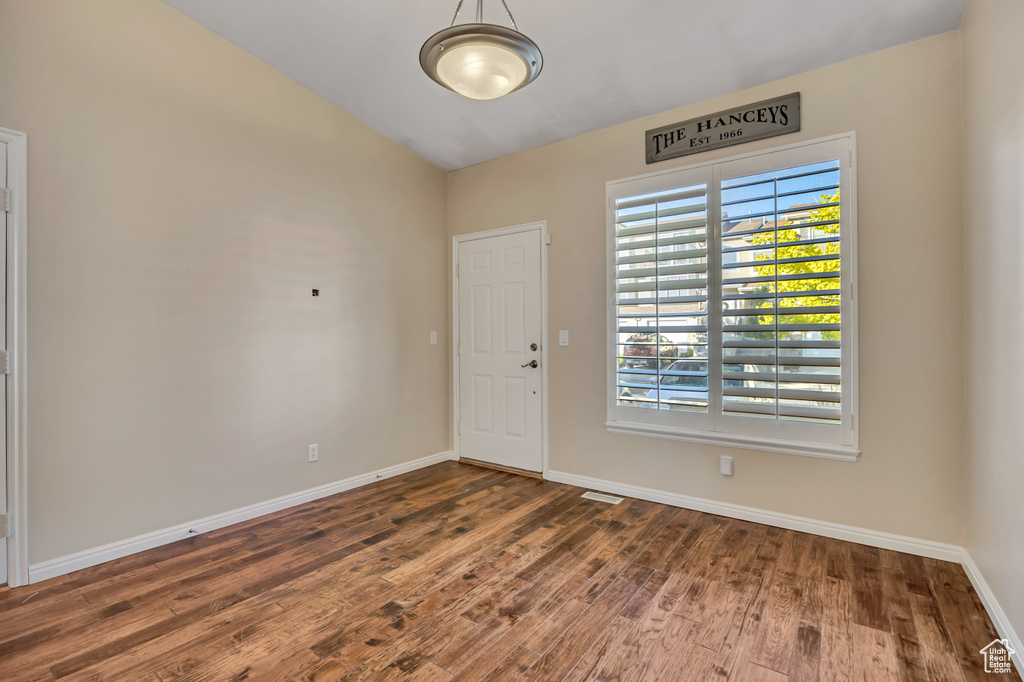 Foyer featuring wood finished floors and baseboards