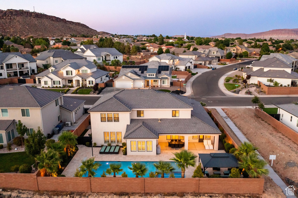 Aerial view at dusk of a residential view and a mountain view