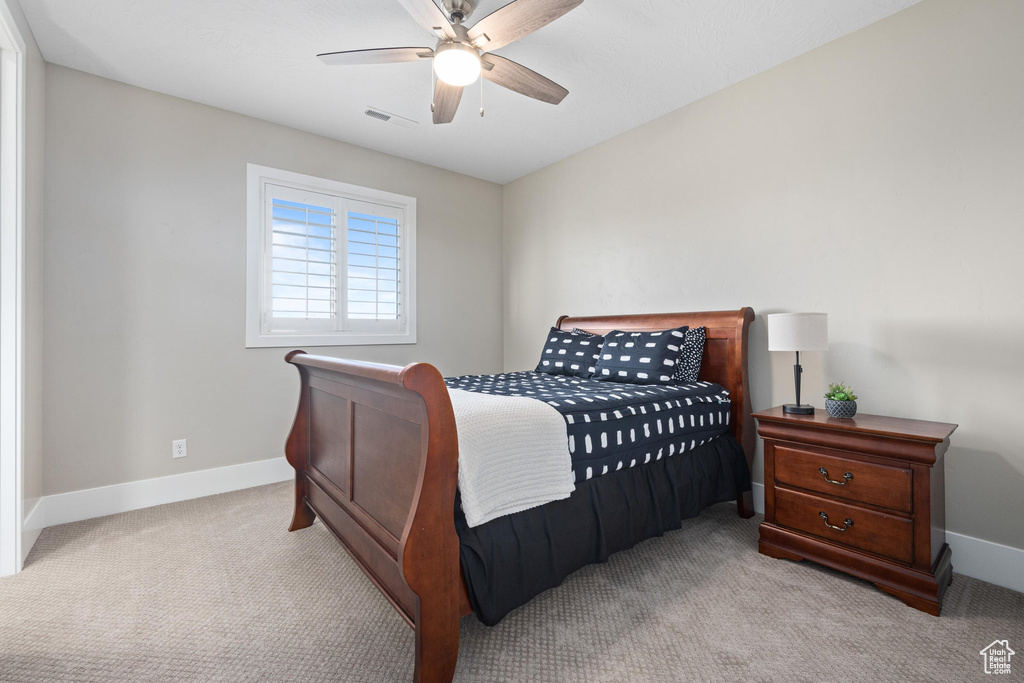 Bedroom featuring carpet and a ceiling fan