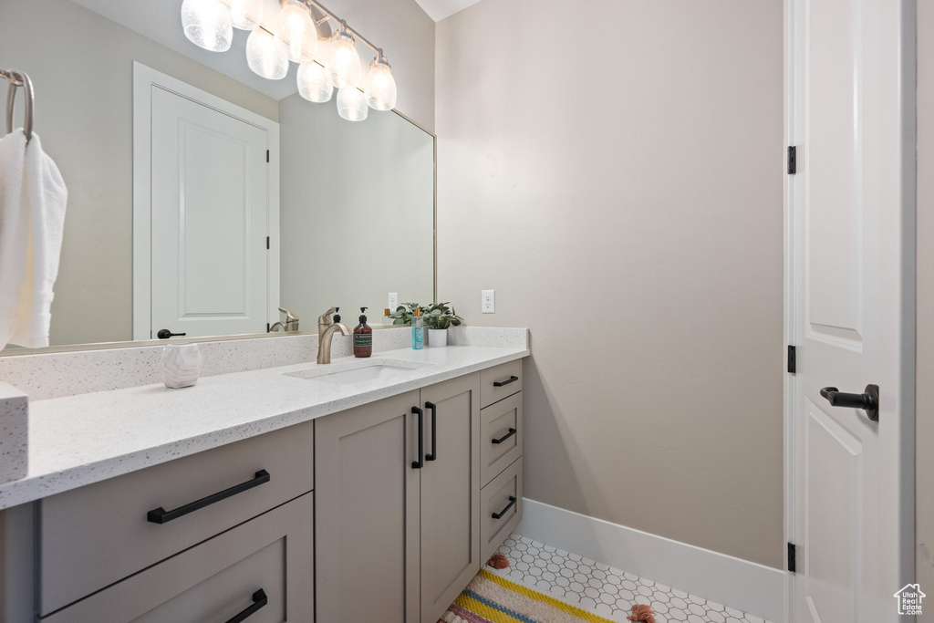 Bathroom with vanity and baseboards
