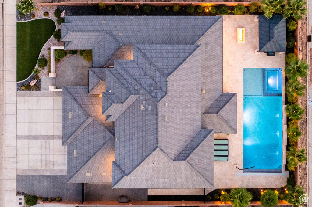 View of subject property with a pool area