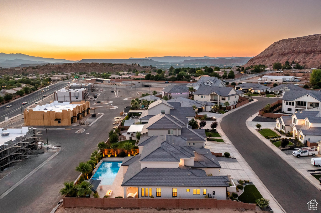 Aerial view at dusk of a mountain view and a residential view
